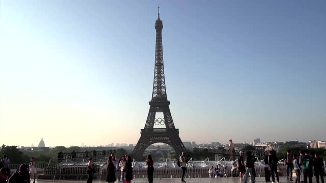 Olympic rings mounted on Eiffel Tower to mark 5...