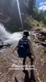 Girl Loses Footing and Falls While Crossing Waterfall on Trail