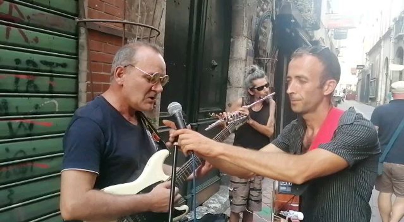 A musician in the street with Fender Stratocaster