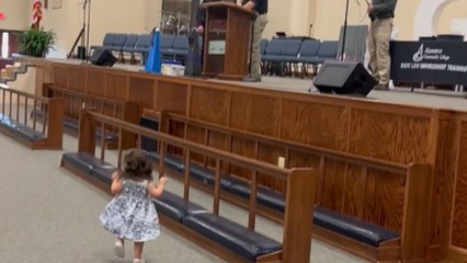 Adorable little girl steals the show while celebrating dad's special moment
