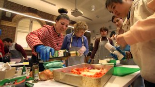 Community cooking class teaching how to keep food costs down while creating new friendships