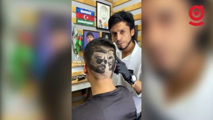 Kafasına hem Atatürk hem Oğuzhan Uğur'un silüetini kazıttı