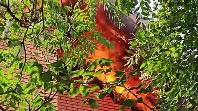 Ukrainian emergency services on the scene of a Russian attack on Kherson