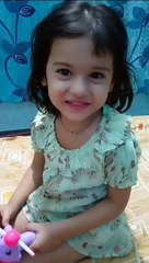 Trishu showing toy helicopter with light on fan