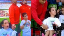 Heartwarming moment Cristiano Ronaldo helps a disabled child onto the pitch before Portugal's Euro 2024 warm-up clash against Ireland... before Al-Nassr star holds her hand throughout the national anthem