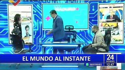 Nicolás Maduro realiza debate con afiches de candidatos a la presidencia