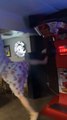Woman Slips And Falls While Trying to Kick Bag on Arcade Punching Machine