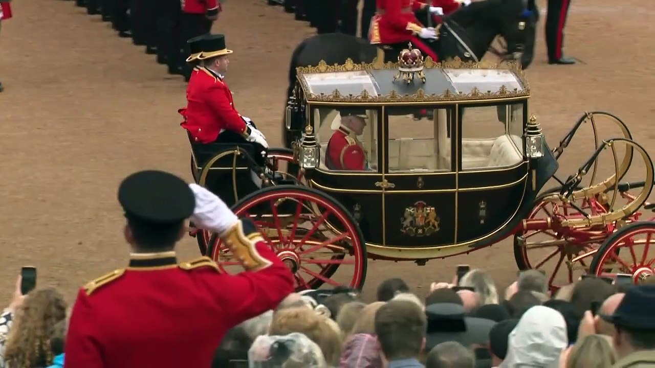 King and Queen watch as birthday parade gets under way