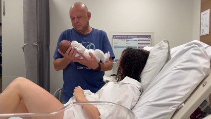 Grandad meets his little princess for the first time