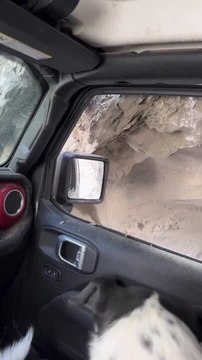 Jeep Scrapes Large Rock While Driving Through Narrow Canyon