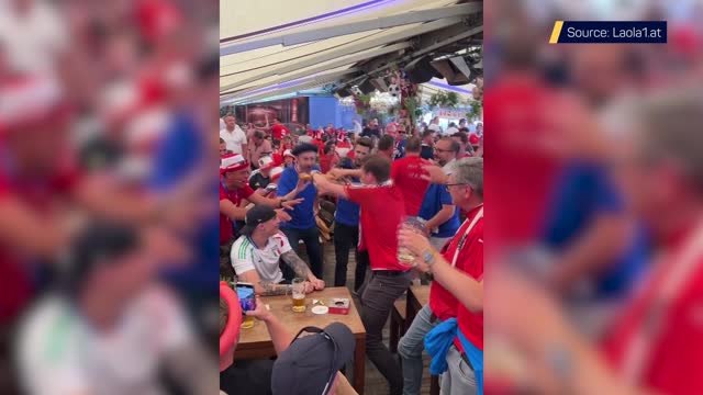 Austrian fans taunt French rivals by snapping baguette