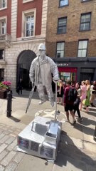 Captures that makes you laugh with Silverman statue on the streets of London
