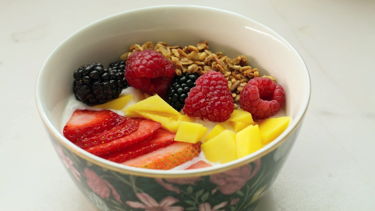 mixkit-bowl-of-yogurt-with-fruit-and-granola-43923-full-hd