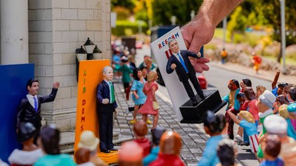 Artist paints miniature figure of Nigel Farage ahead of UK general election