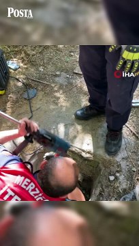 Atık su borusunda mahsur kalan yavru köpeğin imdadına itfaiyeciler yetişti