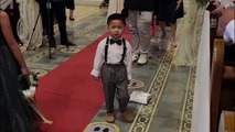 Frustrated little ring bearer stops and tosses ring pillow