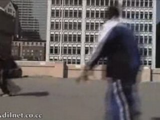 Kobe Bryant jumps over an Aston Martin