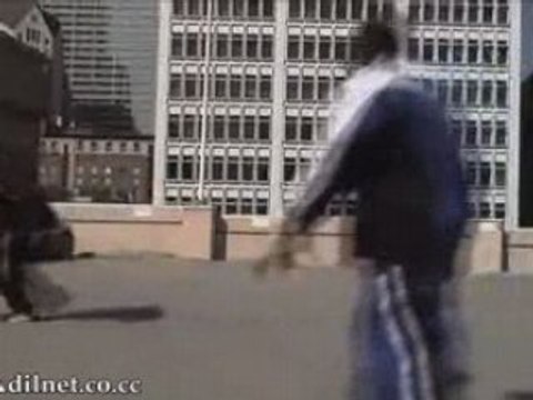 Kobe Bryant jumps over an Aston Martin