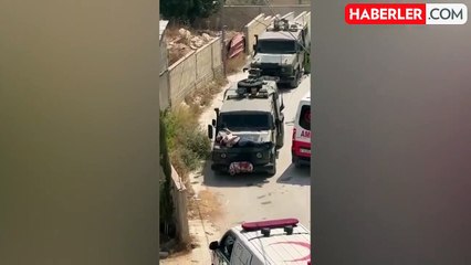 İsrail askerleri skandallara doymuyor! Yaralı Filistinliyi aracın önüne kalkan yaptılar