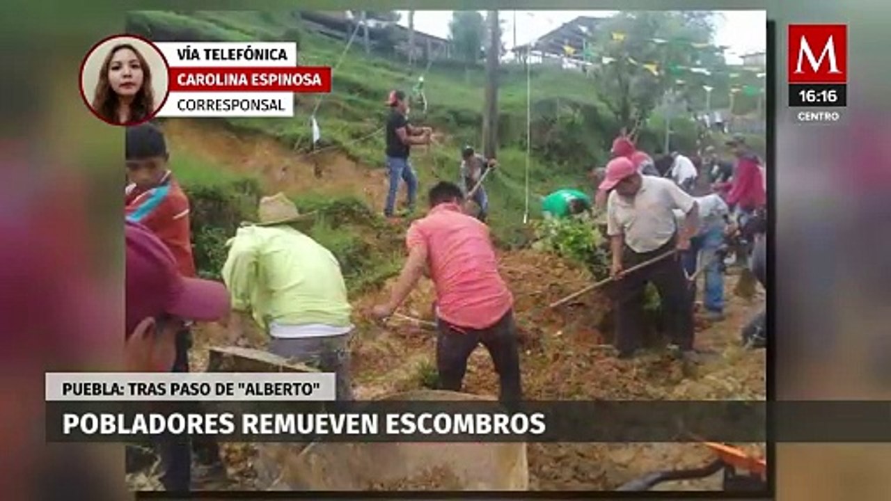 Residentes de Puebla llevan a cabo labores de limpieza después del paso de 'Alberto'