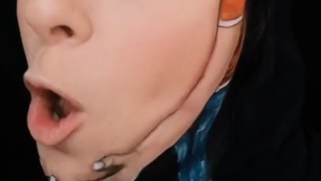 Illusion Makeup Mastery: Artist creates appearance of gigantic face being held