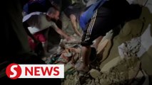 Gazans pull children casualties from under the rubble after overnight strike