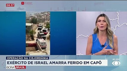 Exército de Israel amarra palestino ferido em capô do carro