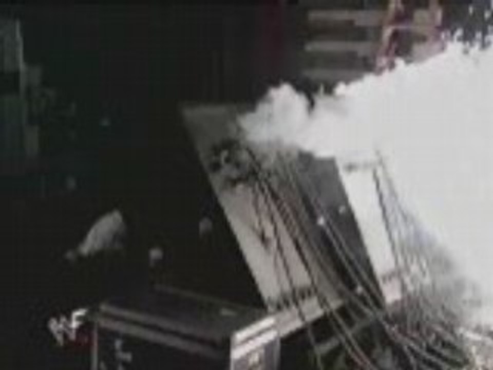 WWE - The Rock Throws Mick Foley onto Explosives