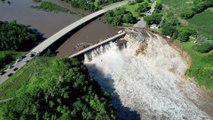 Building swept away after Minnesota dam suffers partial fail