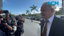 Julian Assange arrives at Saipan court with Kevin Rudd