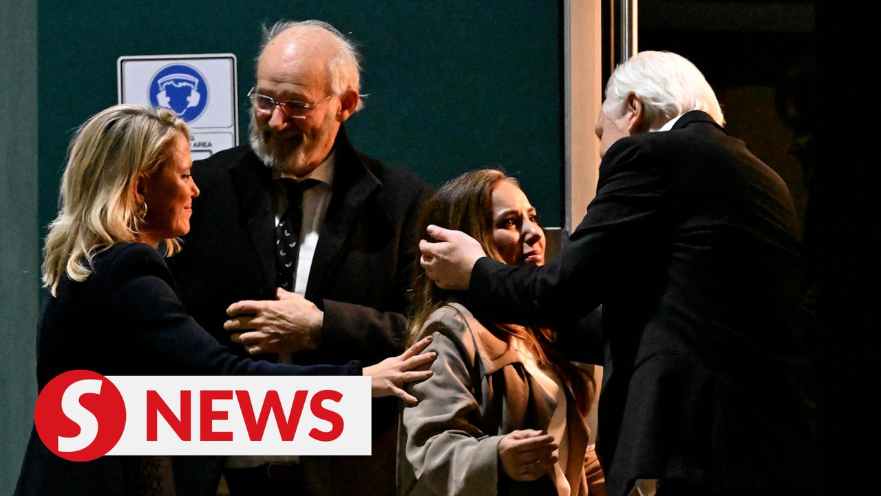 Free man Julian Assange arrives home