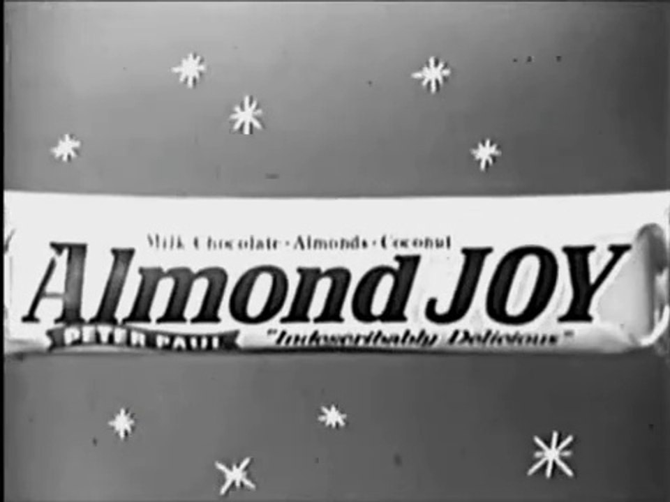 1960s Almond Joy candy IRRESISTABLE URGE at a bus stop TV commercial