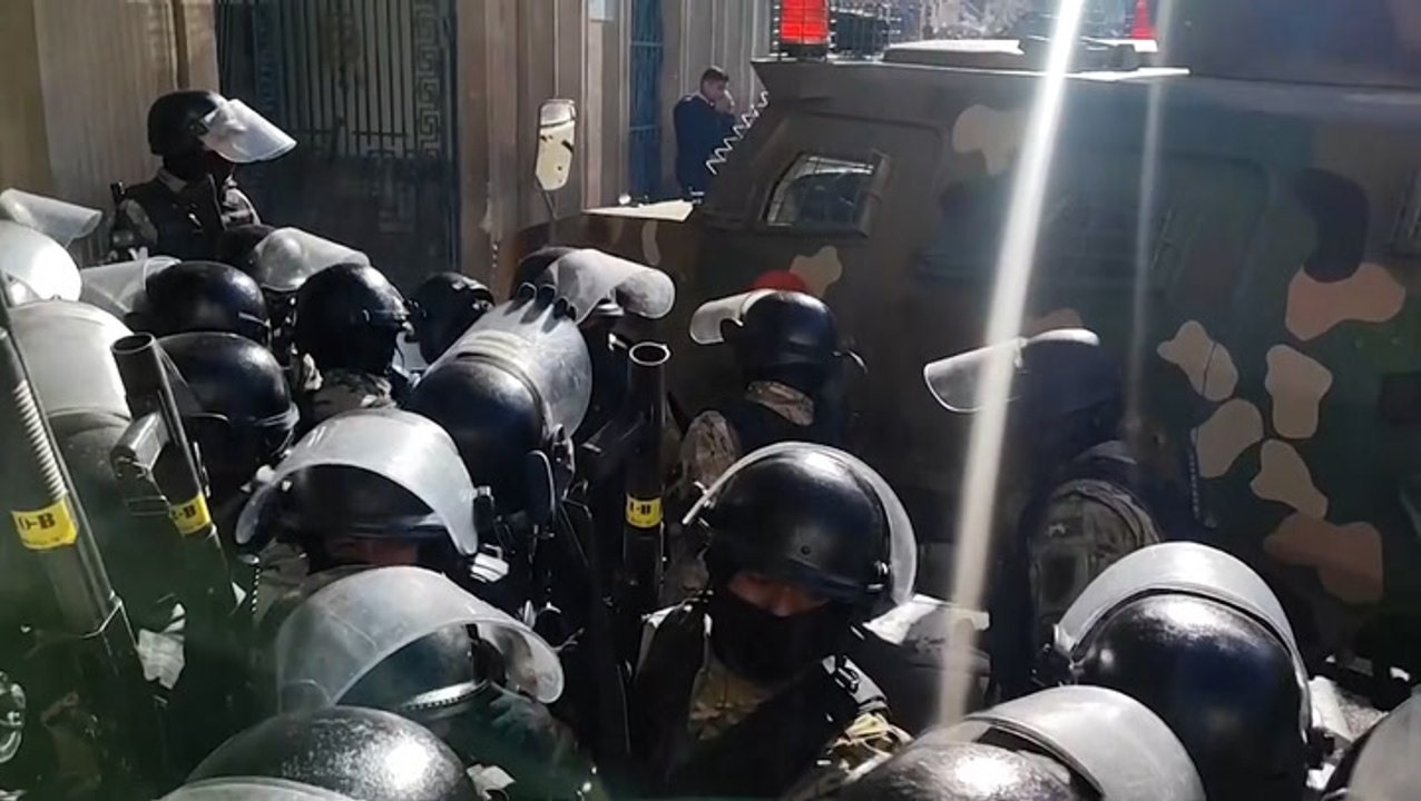 Armoured vehicle breaks through door at Bolivian presidential palace as country faces coup attempt