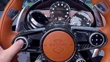 Swiveling screens on a million dollar car? The Zenvo Aurora has no infotainment screen but has two dials that spin, one if you signal a lane change to show a screen with a blind-spot camera image and the other an i