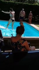 Woman Standing on Wakeboard in Pool Ends Up Hitting Person With it