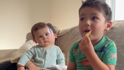 Baby boy can't believe that his big bro isn't a fan of 'Sharing is Caring'