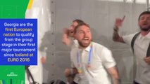Jubilant Georgia players conga through the mixed-zone