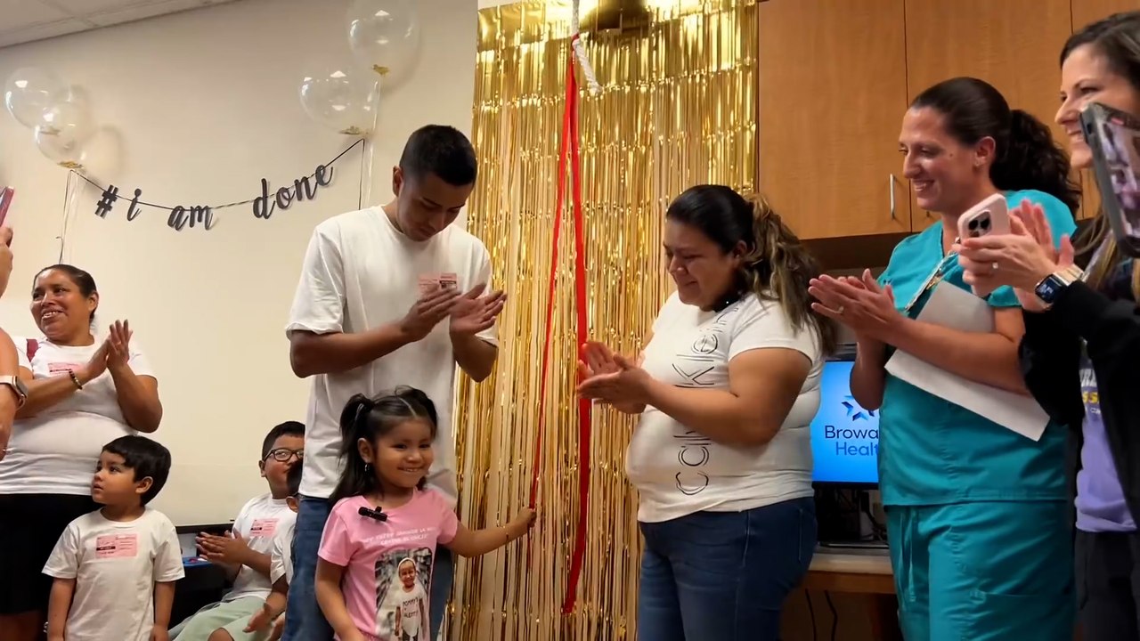 Four-year-old girl rings bell to signify end of chemo treatment