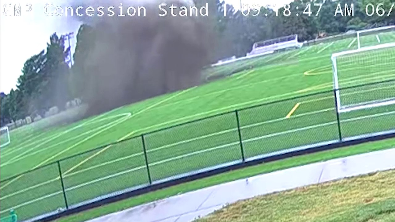 Giant sinkhole swallows football pitch