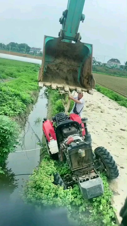 The tractor  fell into the drain 