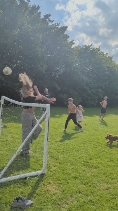 Kid Accidentally Kicks Soccer Ball Into Woman's...