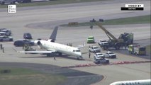 Aerials show Delta jet with damaged tail after taxiing accident
