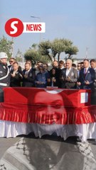 Body of Turkish-American activist killed in West Bank arrives in Turkey