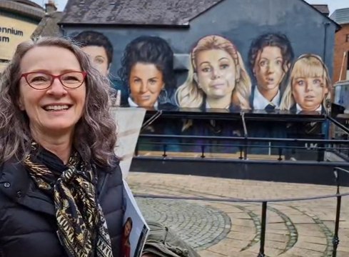 Tourists give their views on Derry Girls mural new pub awning