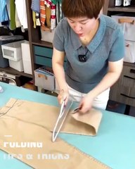 Learn the technique of folding clothes