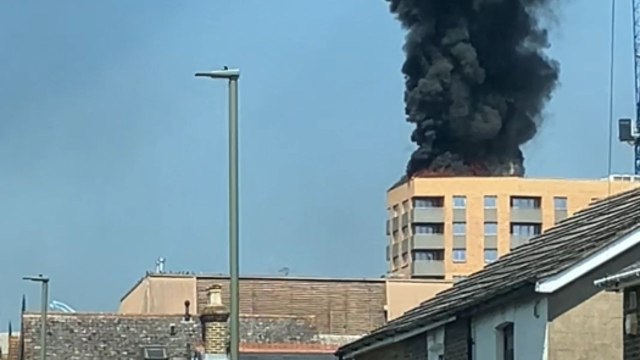 Flames and black smoke overwhelm flats in Staines in a rapidly spreading fire