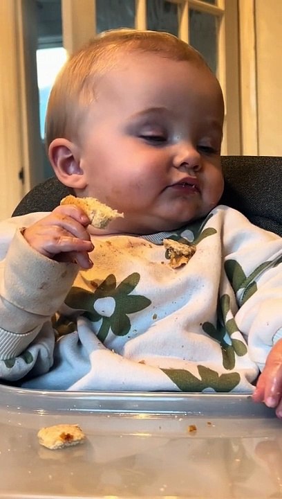 Cute boy eating while sleeping 