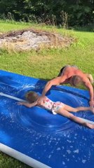 Man Playfully Spins Little Girl on Board