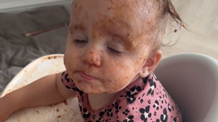 Dinner time mess: Little girl's lasagna battle leaves her covered in sauce