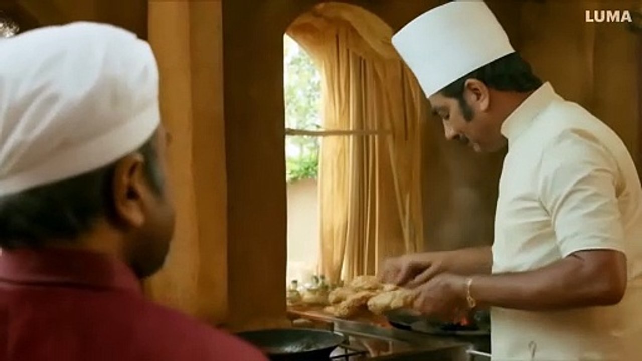 Cut to the kitchen where a middle-aged CHEF,